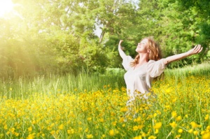 beautiful girl enjoying the summer sun outdoors in the park